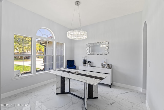 132 Summerhill Cir, Saint Augustine, FL 32086 - office featuring light marble finish flooring, arched walkways, and plenty of natural light