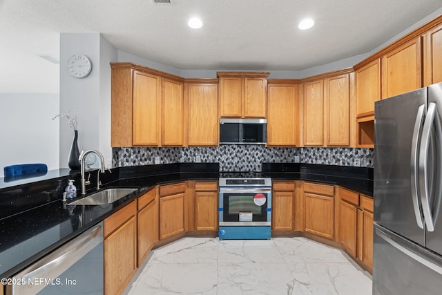 132 Summerhill Cir, Saint Augustine, FL 32086 - kitchen featuring stainless steel appliances, light marble finish flooring, decorative backsplash, dark stone counters, and recessed lighting