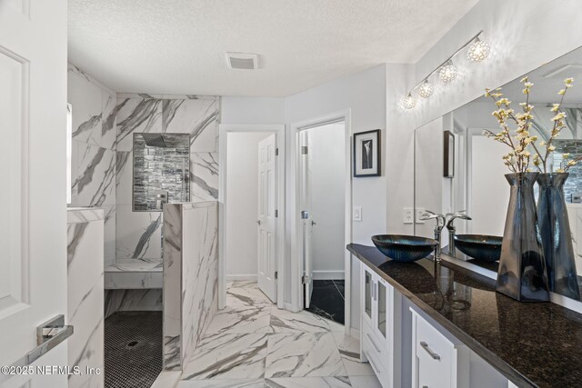 132 Summerhill Cir, Saint Augustine, FL 32086 - full bath featuring marble look tiles, vanity, a marble finish shower, and a textured ceiling