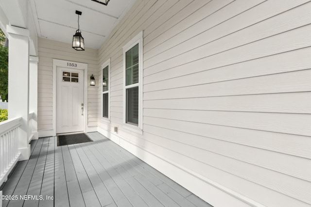 1553 Coastal Oaks Cir, Fernandina Beach, FL 32034 - wooden terrace featuring a porch