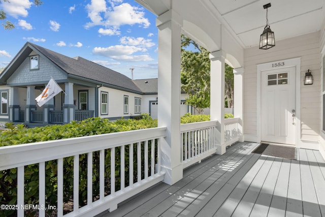 1553 Coastal Oaks Cir, Fernandina Beach, FL 32034 - wooden terrace with covered porch