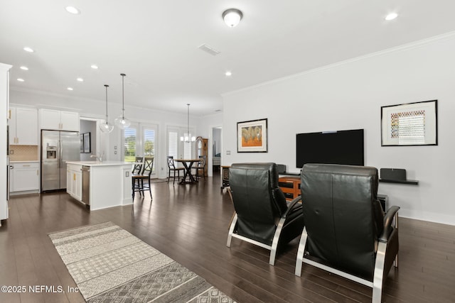 1553 Coastal Oaks Cir, Fernandina Beach, FL 32034 - living room with recessed lighting, ornamental molding, dark wood finished floors, and visible vents