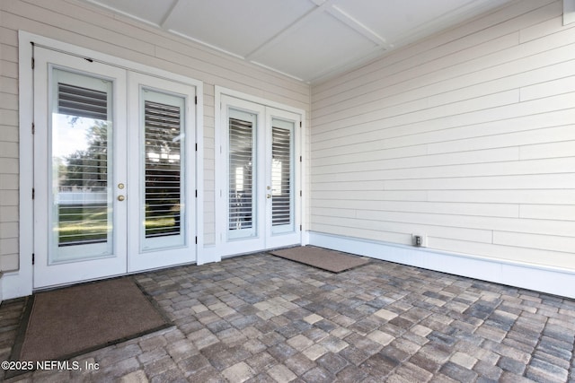 1553 Coastal Oaks Cir, Fernandina Beach, FL 32034 - unfurnished sunroom featuring french doors