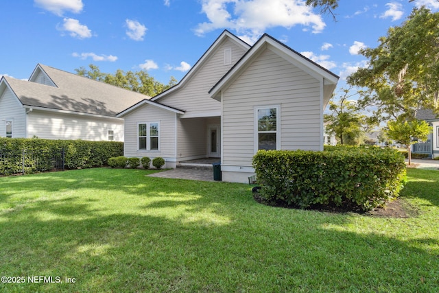 1553 Coastal Oaks Cir, Fernandina Beach, FL 32034 - view of front of house with a front lawn