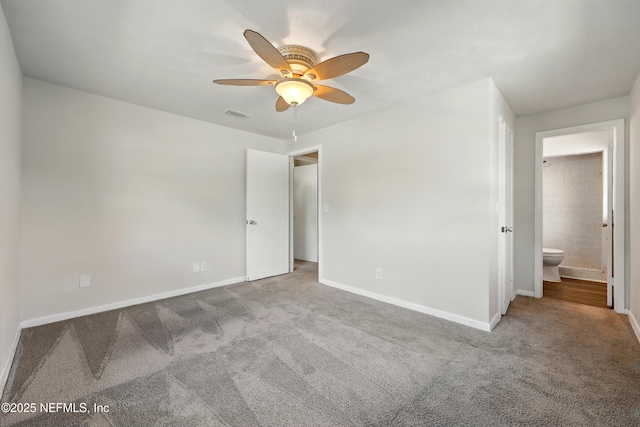 unfurnished bedroom with carpet floors, baseboards, ceiling fan, and visible vents