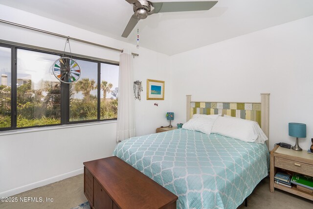 2900 Coastal Hwy # 1, Saint Augustine, FL 32084 - carpeted bedroom featuring baseboards and a ceiling fan