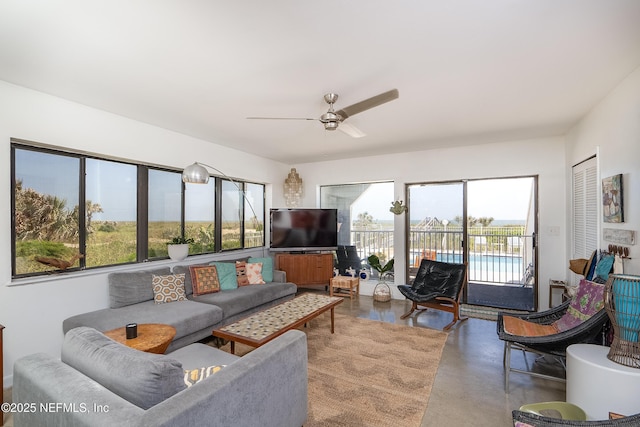 2900 Coastal Hwy # 1, Saint Augustine, FL 32084 - living area with a ceiling fan and concrete flooring