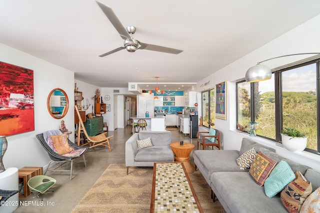 2900 Coastal Hwy # 1, Saint Augustine, FL 32084 - living room featuring finished concrete floors and a ceiling fan