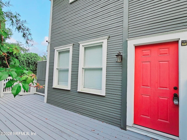 entrance to property featuring a deck