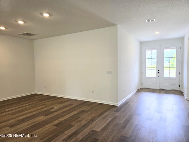 3267 Pipers Way, Green Cove Springs, FL 32043 - empty room with dark wood-type flooring, a textured ceiling, baseboards, french doors, and recessed lighting