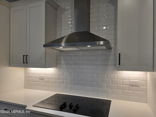 3267 Pipers Way, Green Cove Springs, FL 32043 - kitchen featuring wall chimney exhaust hood, black electric stovetop, decorative backsplash, and light countertops