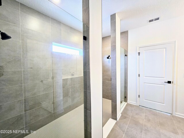 3267 Pipers Way, Green Cove Springs, FL 32043 - bathroom with a walk in shower, tile patterned flooring, and baseboards