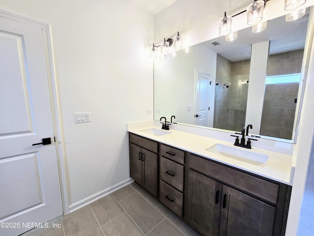 3267 Pipers Way, Green Cove Springs, FL 32043 - bathroom featuring tile patterned floors, a shower stall, double vanity, and baseboards
