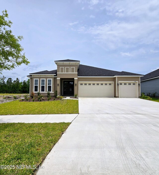 3267 Pipers Way, Green Cove Springs, FL 32043 - prairie-style home featuring a garage, driveway, and a front yard