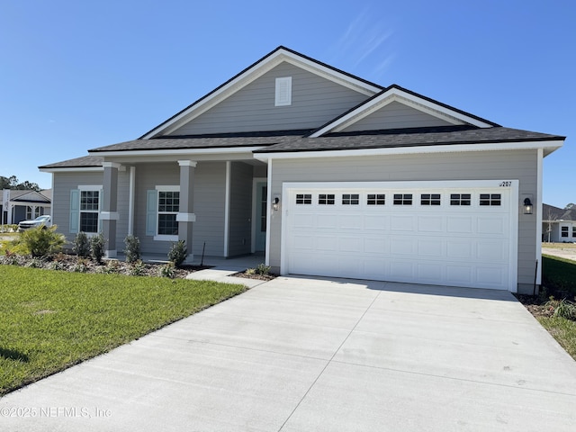 2672 Charmer Ct, Green Cove Springs, FL 32043 - view of front facade with a garage, a shingled roof, a front lawn, and driveway