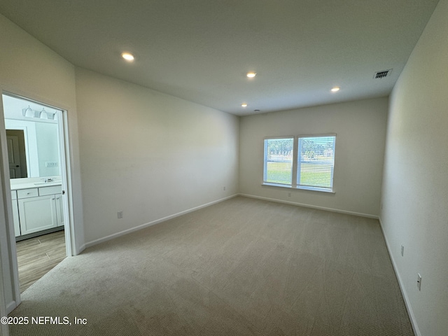 2672 Charmer Ct, Green Cove Springs, FL 32043 - spare room with light carpet, a sink, recessed lighting, baseboards, and visible vents