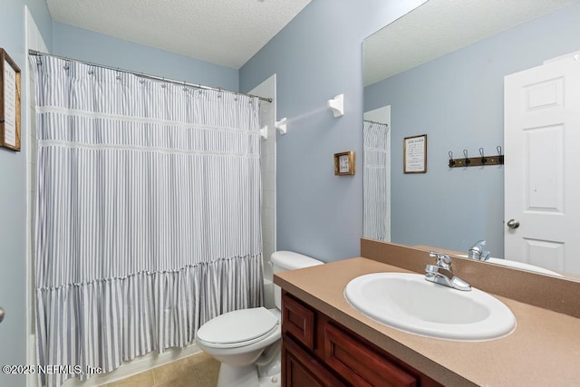 bathroom with a textured ceiling, vanity, tile patterned floors, toilet, and a shower with shower curtain