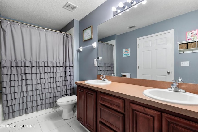 bathroom featuring visible vents, a sink, and toilet