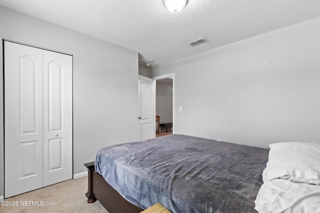 4323 Warm Springs Way, Middleburg, FL 32068 - bedroom featuring light colored carpet, a closet, and a textured ceiling