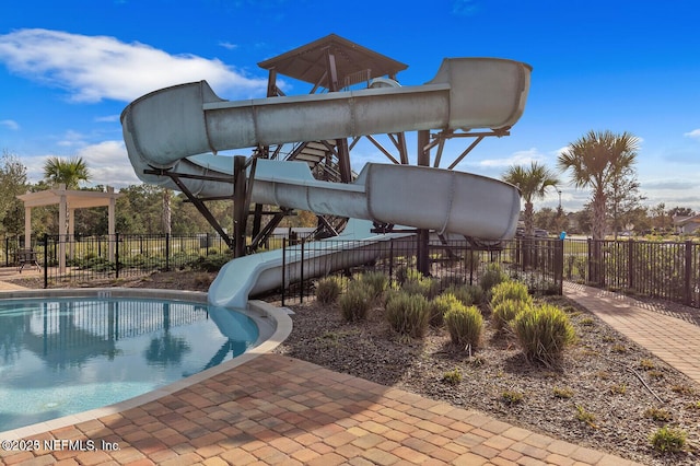 4323 Warm Springs Way, Middleburg, FL 32068 - view of pool with a water slide, fence, and a playground