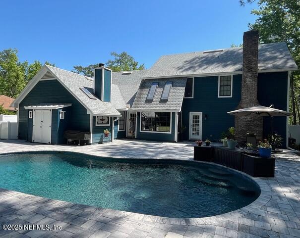 outdoor pool with a patio