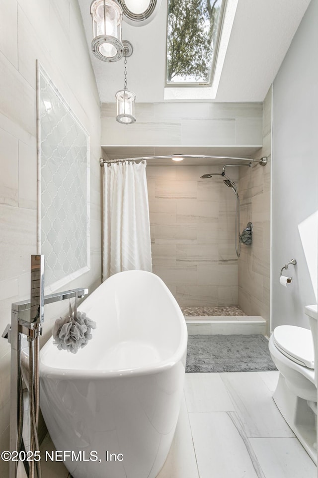 full bath with a soaking tub, a skylight, toilet, and tiled shower