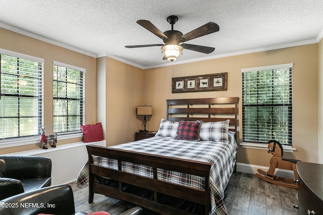 bedroom with crown molding, a textured ceiling, ceiling fan, and wood finished floors