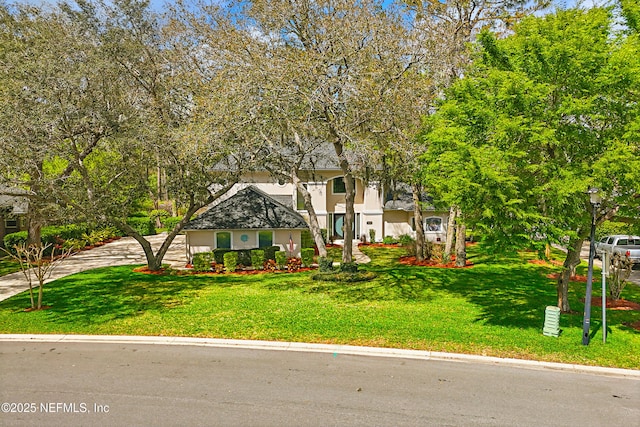 1304 Hideaway Dr S, Saint Johns, FL 32259 - view of front of home featuring stucco siding, a front lawn, and concrete driveway