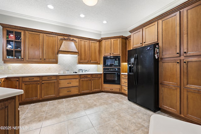 1304 Hideaway Dr S, Saint Johns, FL 32259 - kitchen with black appliances, brown cabinets, custom exhaust hood, ornamental molding, and a textured ceiling