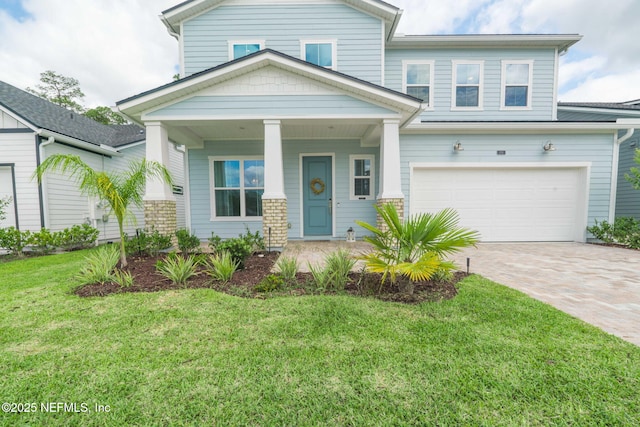 201 Bridgeton St, Saint Johns, FL 32259 - traditional-style house with covered porch, decorative driveway, an attached garage, and a front yard