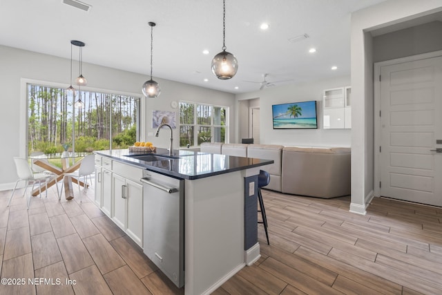 201 Bridgeton St, Saint Johns, FL 32259 - kitchen with baseboards, a sink, white cabinetry, and wood tiled floor