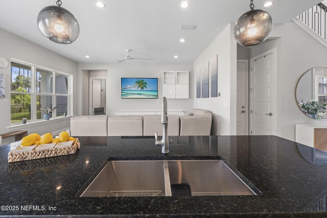 201 Bridgeton St, Saint Johns, FL 32259 - kitchen with open floor plan, ceiling fan, recessed lighting, a sink, and dark stone countertops