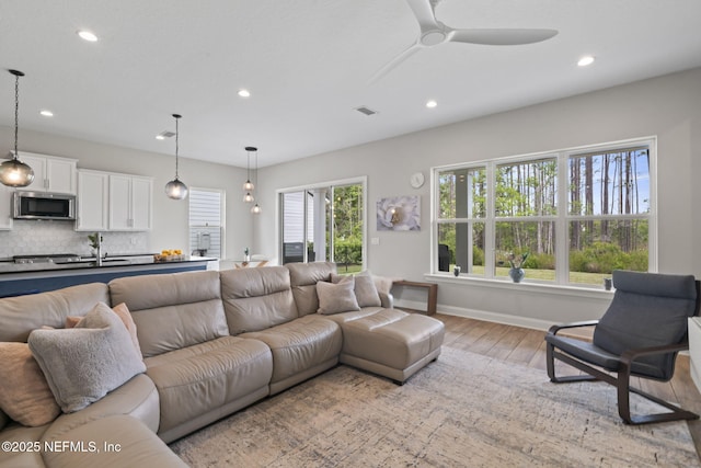 201 Bridgeton St, Saint Johns, FL 32259 - living room with a ceiling fan, visible vents, baseboards, light wood-style floors, and recessed lighting
