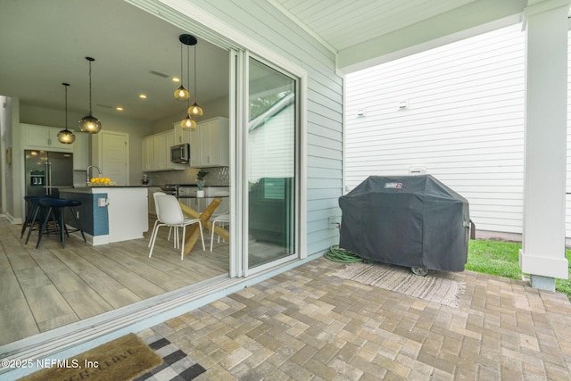 201 Bridgeton St, Saint Johns, FL 32259 - view of patio featuring visible vents, a sink, outdoor dry bar, and a grill