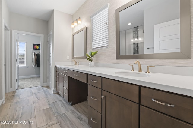 201 Bridgeton St, Saint Johns, FL 32259 - full bathroom featuring a sink, baseboards, double vanity, and a spacious closet