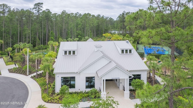 201 Bridgeton St, Saint Johns, FL 32259 - view of front facade with a standing seam roof, metal roof, and a forest view