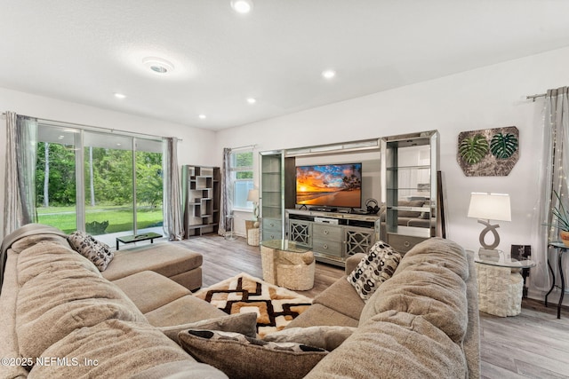 120 Oakleaf Way, Palm Coast, FL 32137 - living area featuring recessed lighting and light wood-style flooring