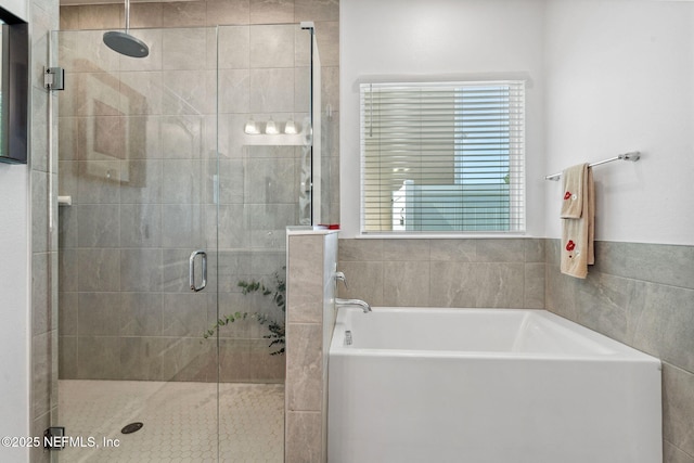 120 Oakleaf Way, Palm Coast, FL 32137 - bathroom featuring a shower stall and a garden tub