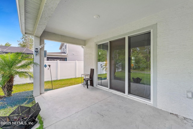 120 Oakleaf Way, Palm Coast, FL 32137 - view of patio featuring fence