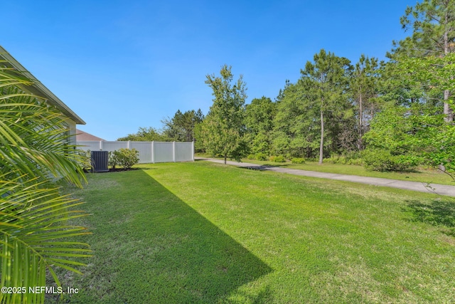 120 Oakleaf Way, Palm Coast, FL 32137 - view of yard featuring central AC and fence