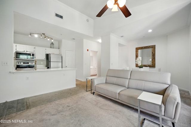 150 Veracruz Dr Unit 537, Ponte Vedra Beach, FL 32082 - living area with light colored carpet, visible vents, a ceiling fan, and ornamental molding