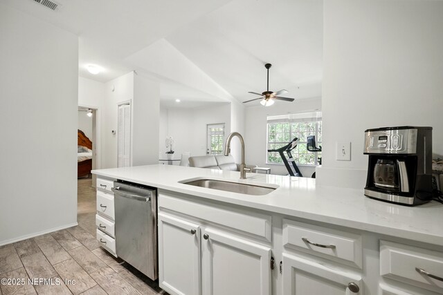 150 Veracruz Dr Unit 537, Ponte Vedra Beach, FL 32082 - kitchen featuring a sink, lofted ceiling, white cabinetry, a ceiling fan, and stainless steel dishwasher