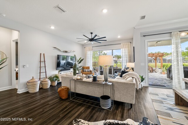 living area with a ceiling fan, baseboards, wood finished floors, and recessed lighting
