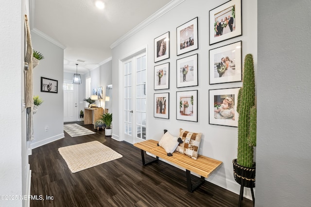 hallway featuring crown molding, wood finished floors, and baseboards