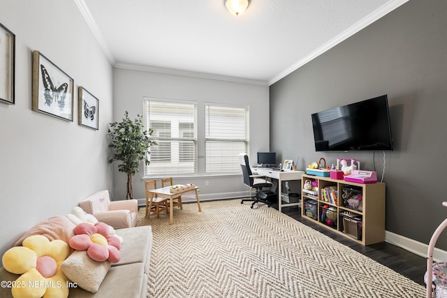 office area featuring wood finished floors, crown molding, and baseboards