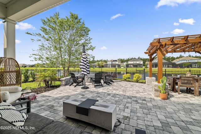 view of patio / terrace featuring outdoor dining space, a pergola, a fenced backyard, a water view, and a residential view