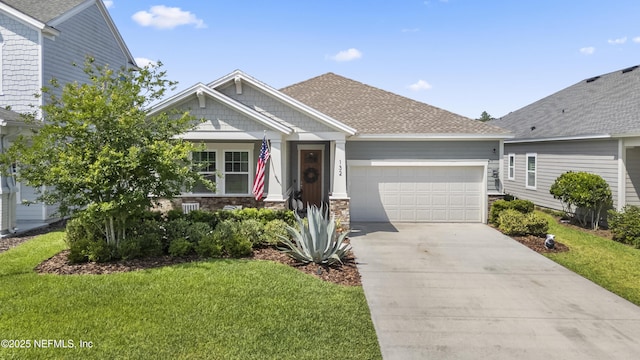 view of front of home featuring an attached garage, concrete driveway, a front lawn, stone siding, and a shingled roof