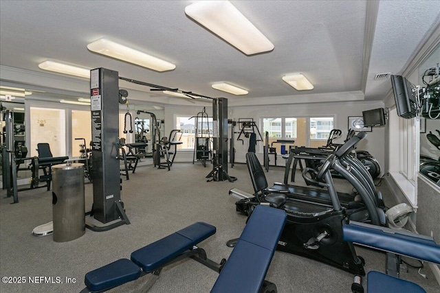 gym featuring ornamental molding and a textured ceiling