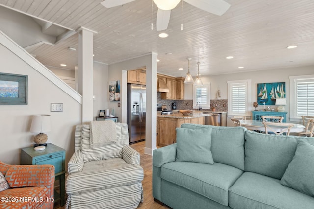 living room featuring recessed lighting, a ceiling fan, wooden ceiling, and light wood finished floors