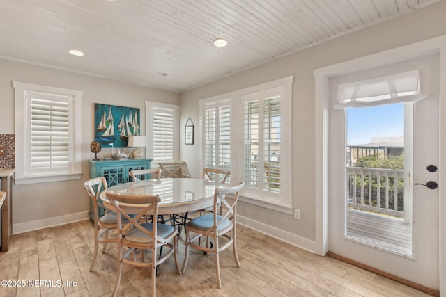 dining room with recessed lighting, baseboards, and light wood-type flooring